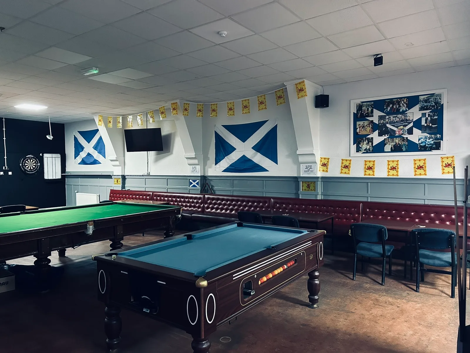 The games room with a pool table, snooker table and seating